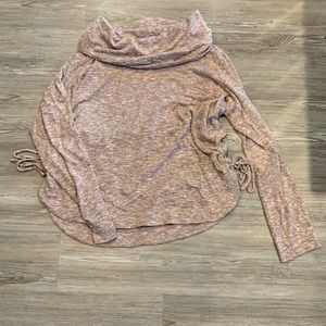 Women’s sweater size L with ties on the side.